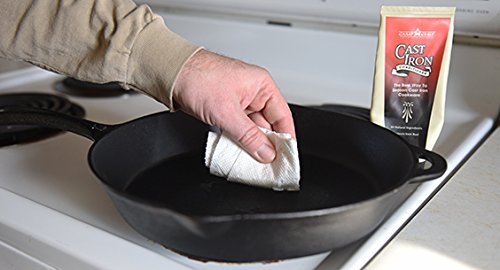 Applying Camp Chef conditioner to a skillet to build protective seasoning