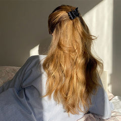 Canitor butterfly clip holding bangs back to keep vision clear during tasks