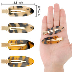 Canitor four-clip set laid flat showing two tortoise patterns and multi-use benefit