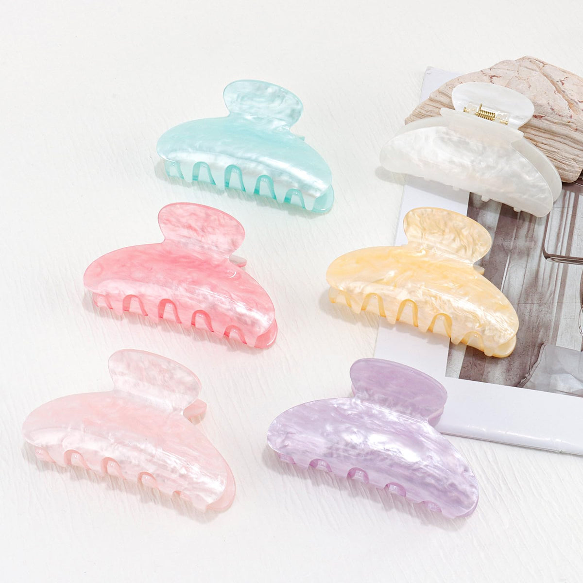 Canitor front view of marbled acrylic clip showing stylish finish and secure hold