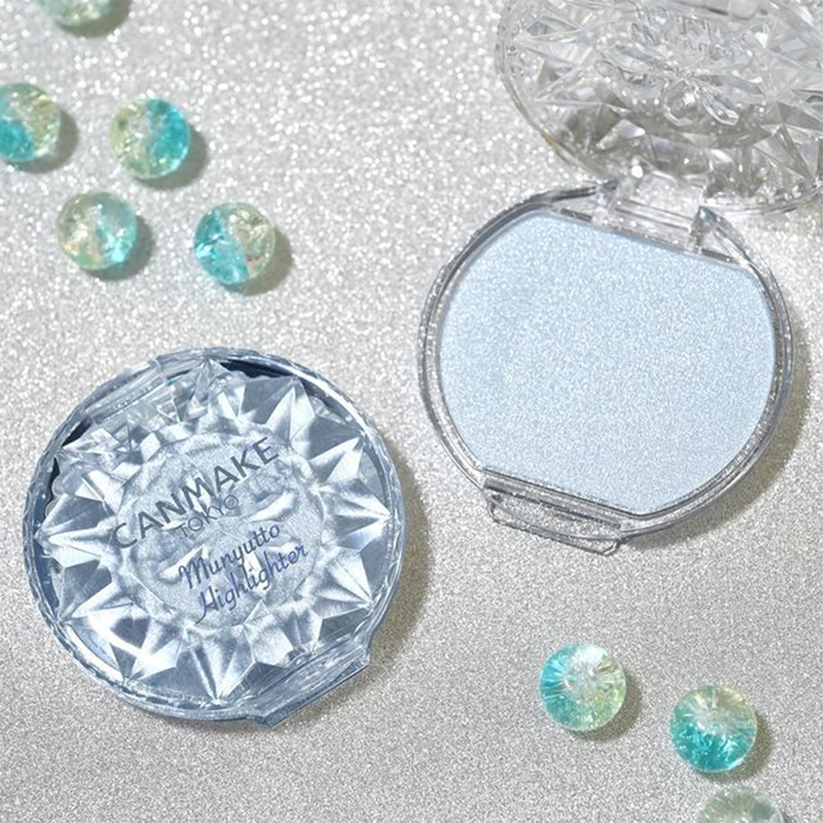 CANMAKE Munyutto beside coin showing compact size and travel-friendly convenience benefit
