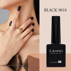 CANNI brush applying black gel on nail tip for precise DIY manicure benefit