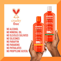 Cantu conditioner applied to hair mid-lengths showing detangling benefit