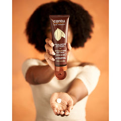 Closeup of Cantu cream texture demonstrating rich, fast absorption benefit