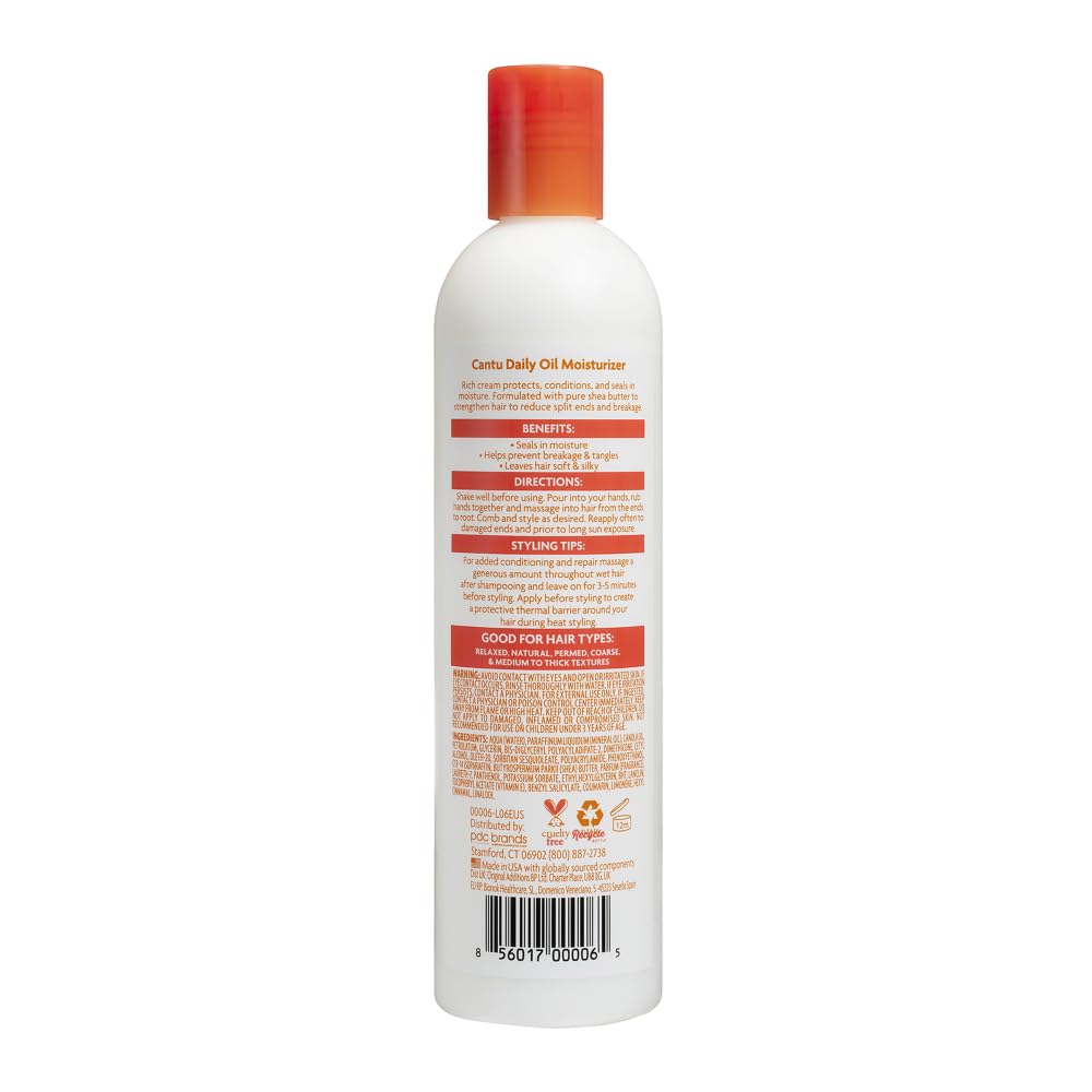 Cantu daily oil moisturizer pump application on hands demonstrating controlled dispense and smooth finish