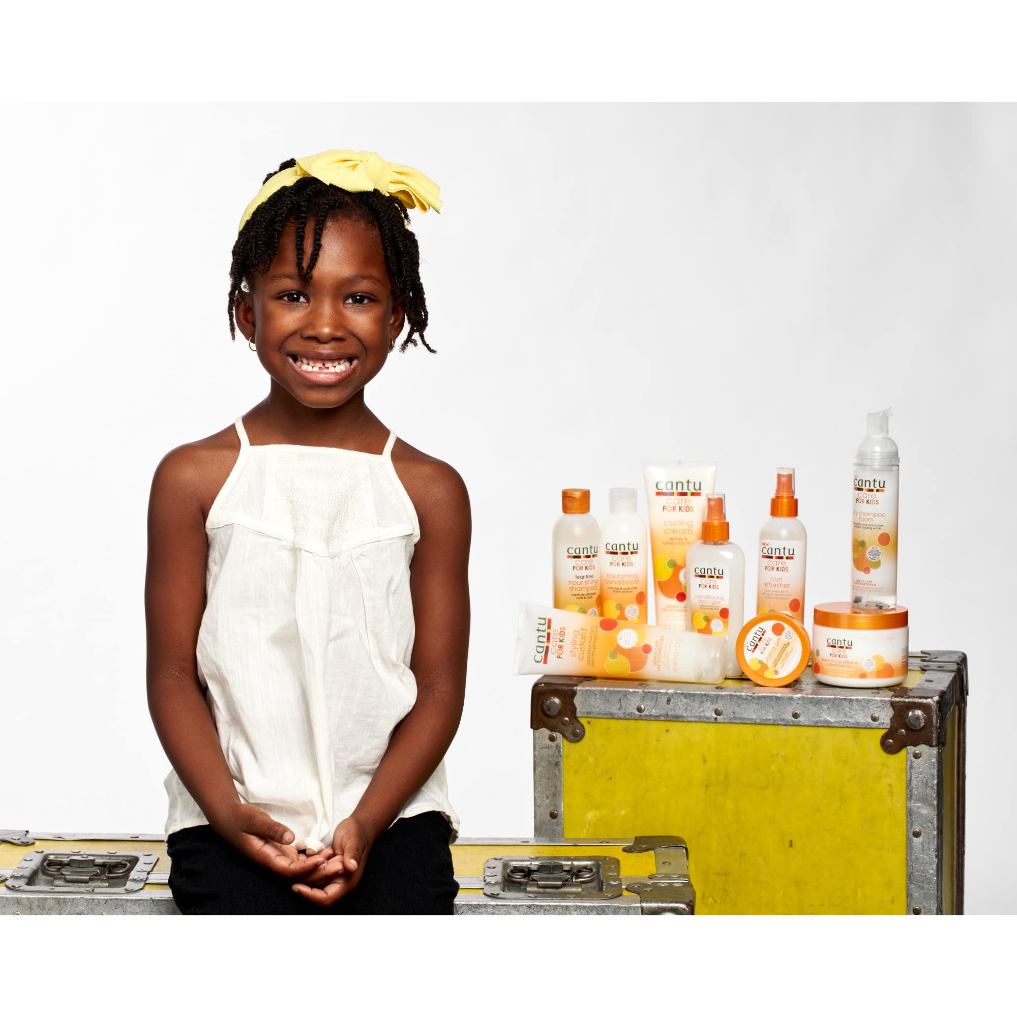 Shea butter coconut oil and honey visuals with Cantu bottle highlighting nourishing ingredients