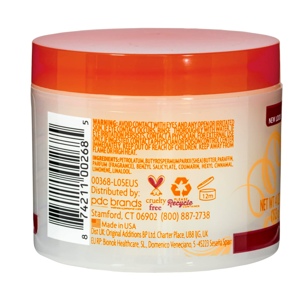 Cantu pomade in use styling hair demonstrating control and defined shine