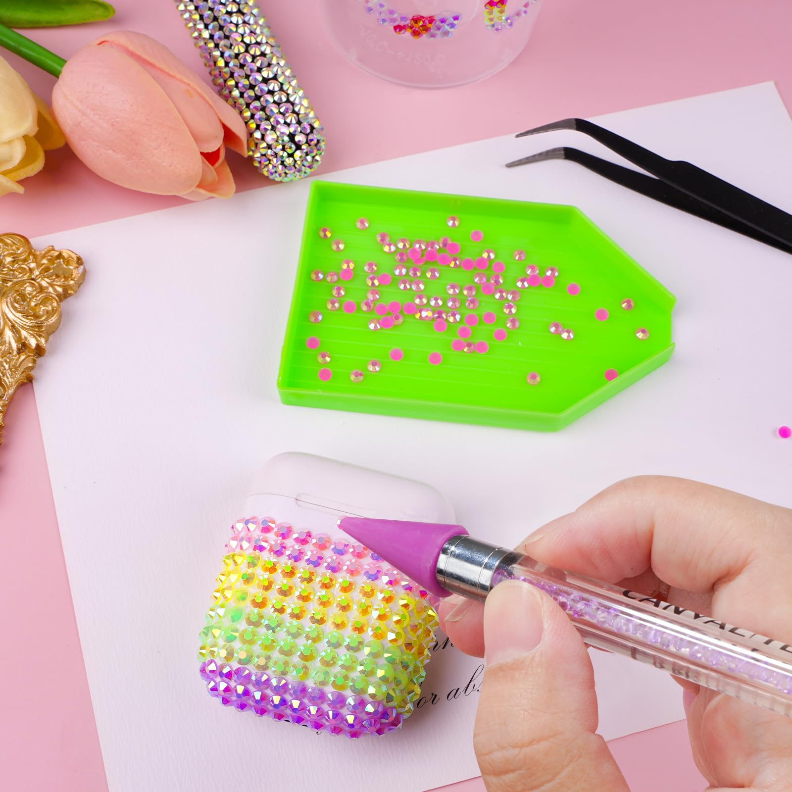 CANVALITE rhinestones being applied to nails demonstrating easy decorative use