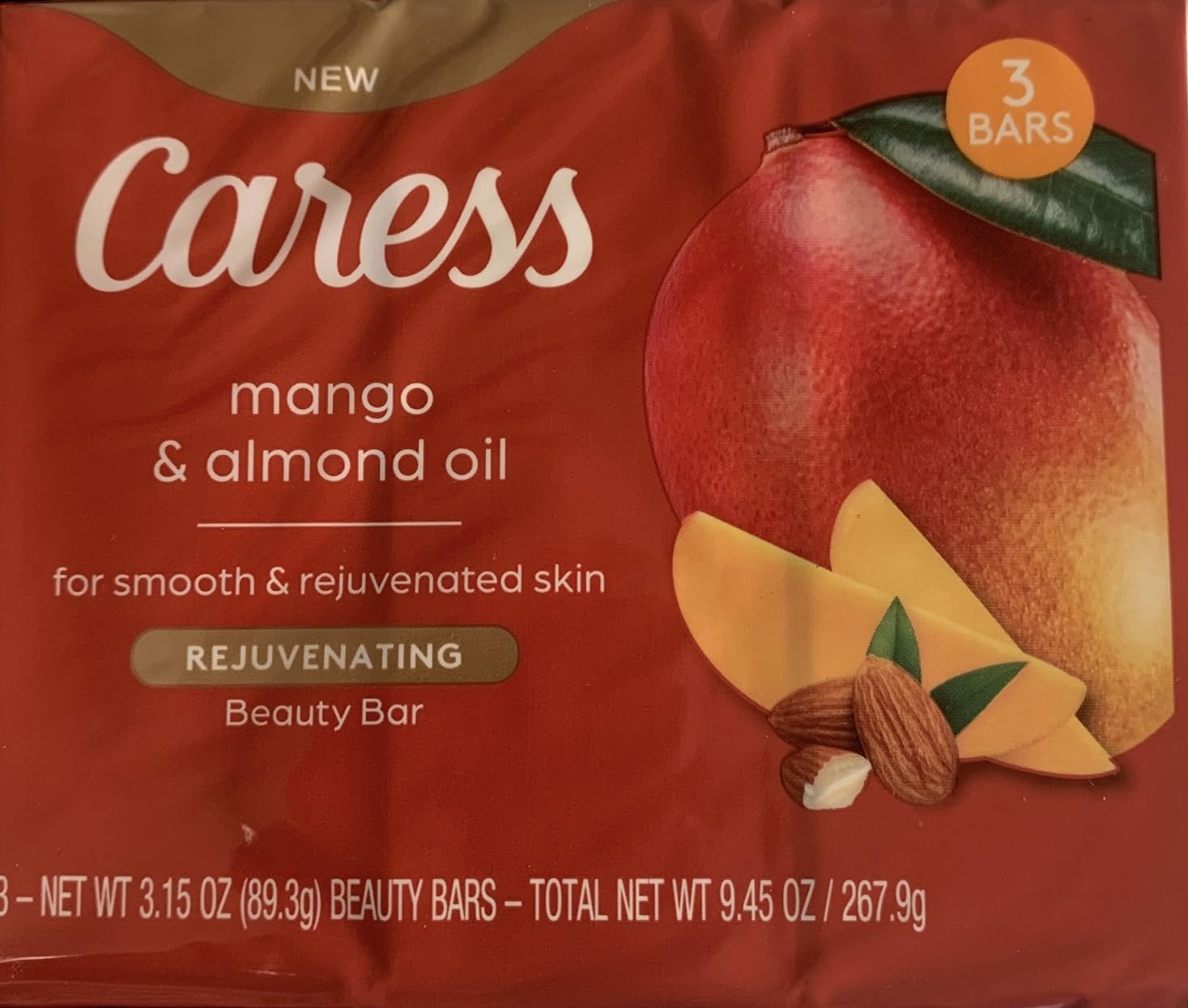 Caress mango and almond oil front packaging showing three bars, nourishes skin