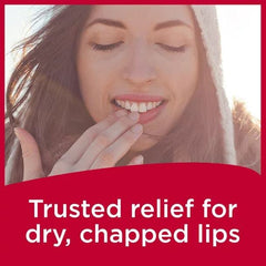 applying Carmex to lips demonstrating soothing, cooling lip comfort