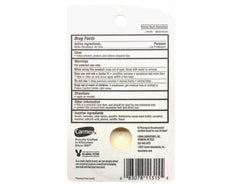 Carmex original pot on a nightstand next to a glass of water, ideal for nighttime lip care