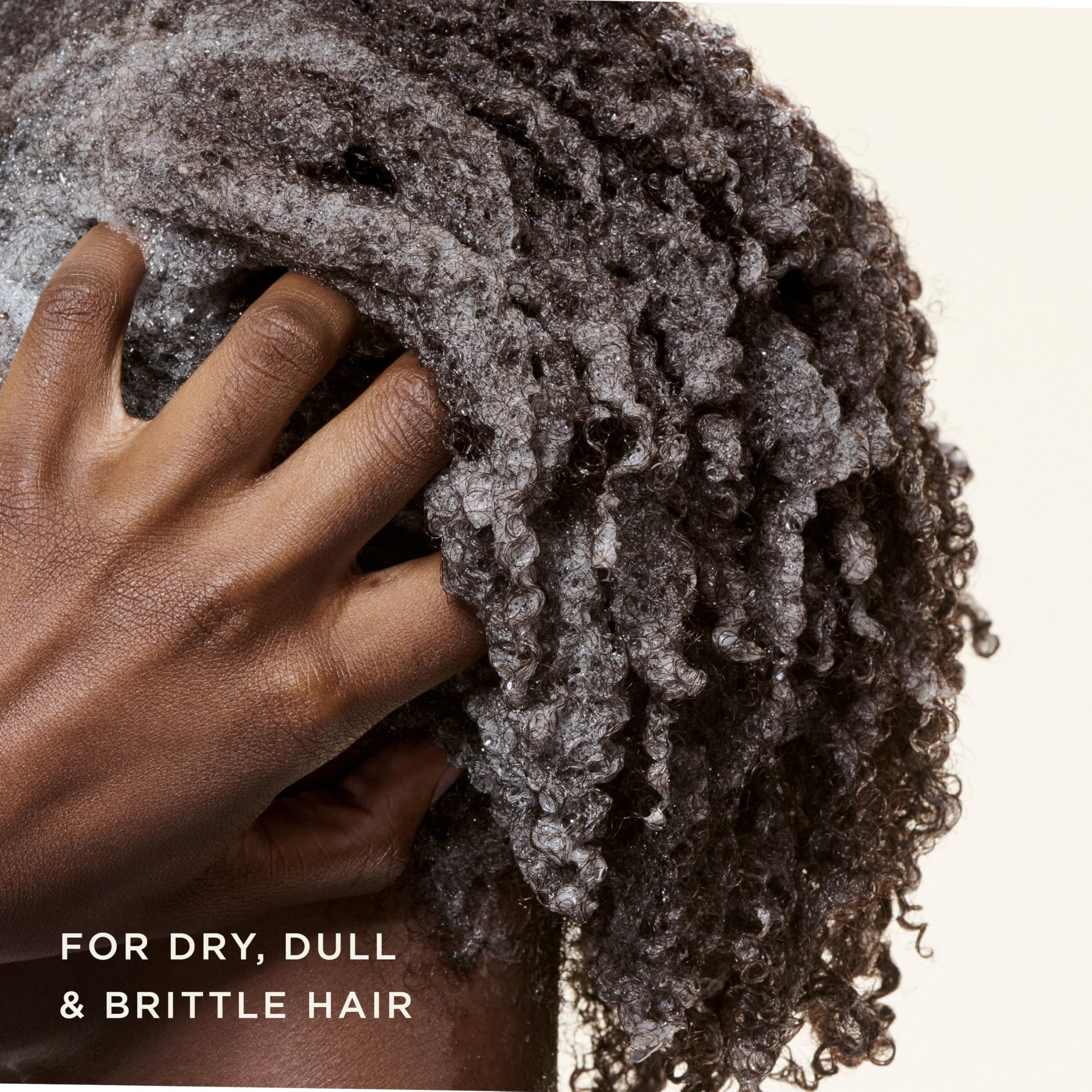 Carol's Daughter creamy lather texture demonstrating gentle cleansing and moisture