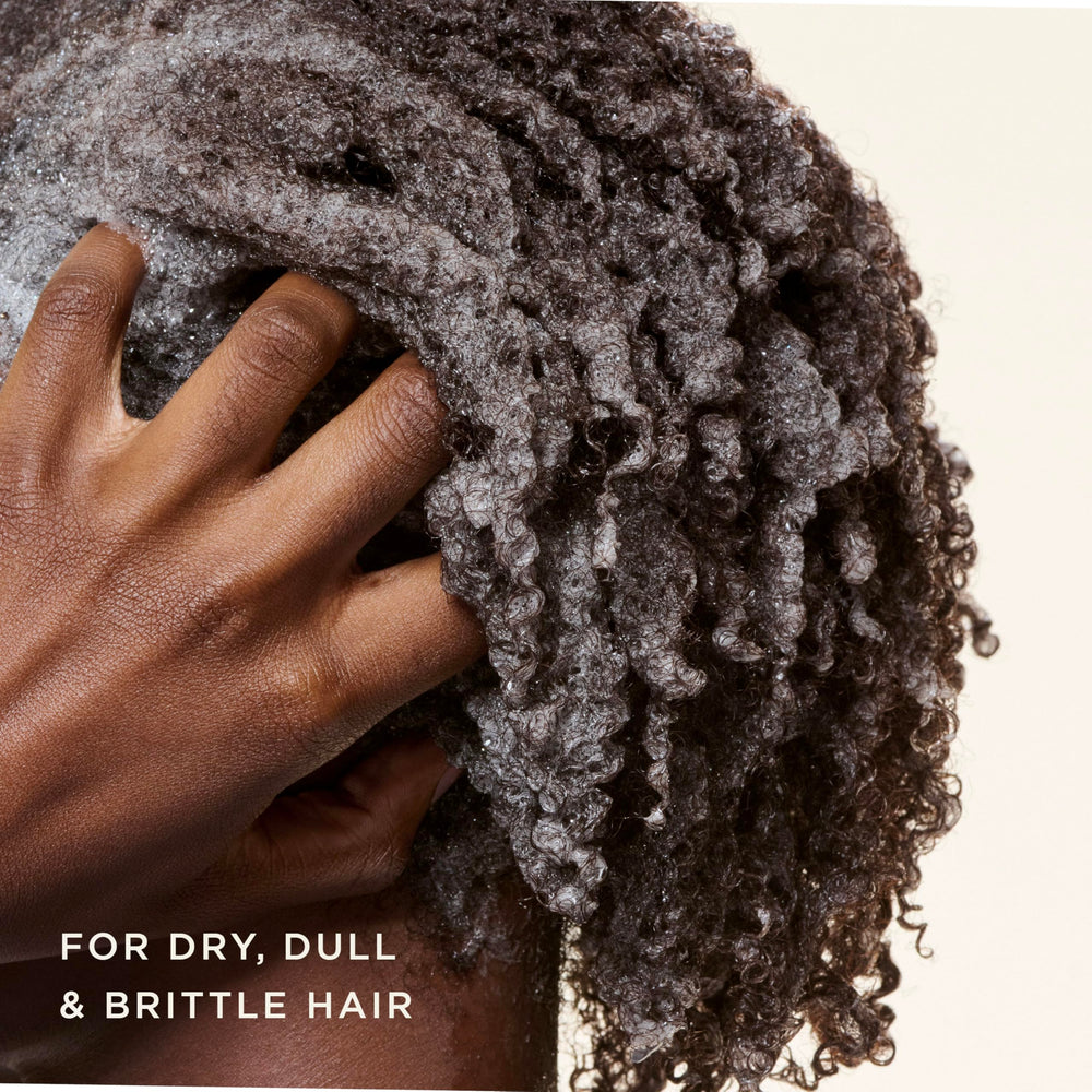 Carol's Daughter creamy lather texture demonstrating gentle cleansing and moisture