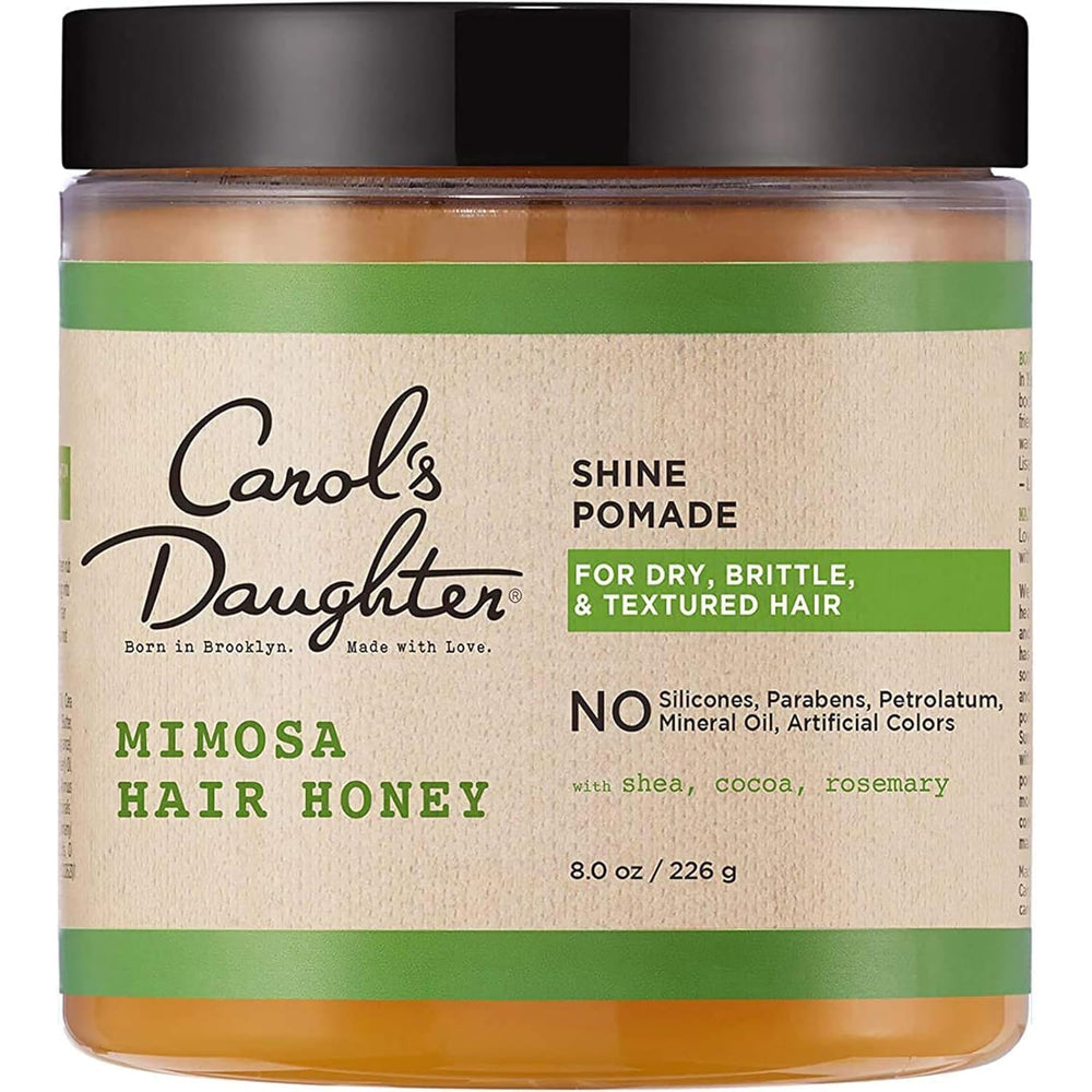 Carol's Daughter jar front view showing label and citrus-scented pomade benefit