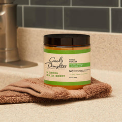 Close-up texture of Mimosa Hair Honey highlighting creamy shea butter richness