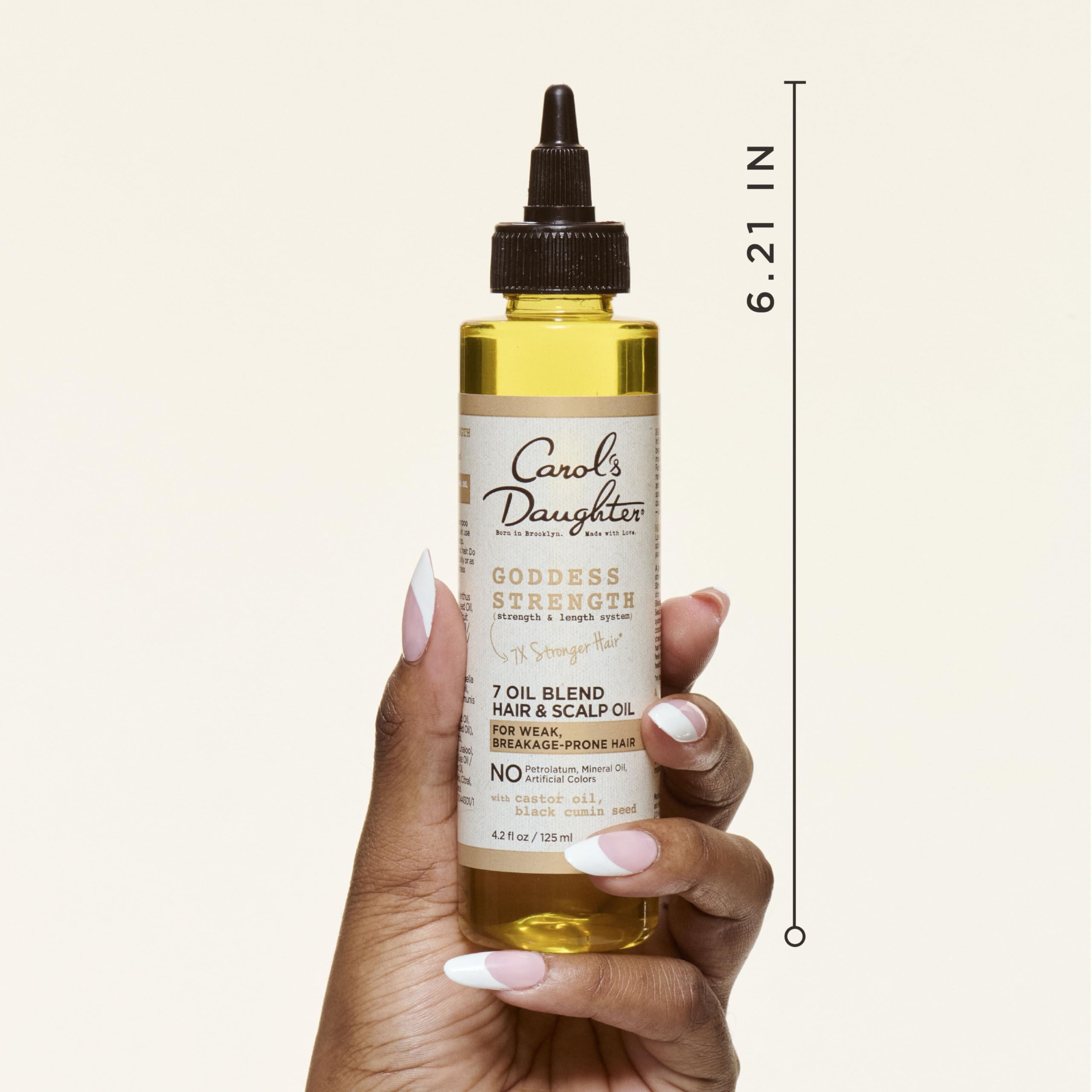 Carol's Daughter applicator tip close-up for precise scalp placement