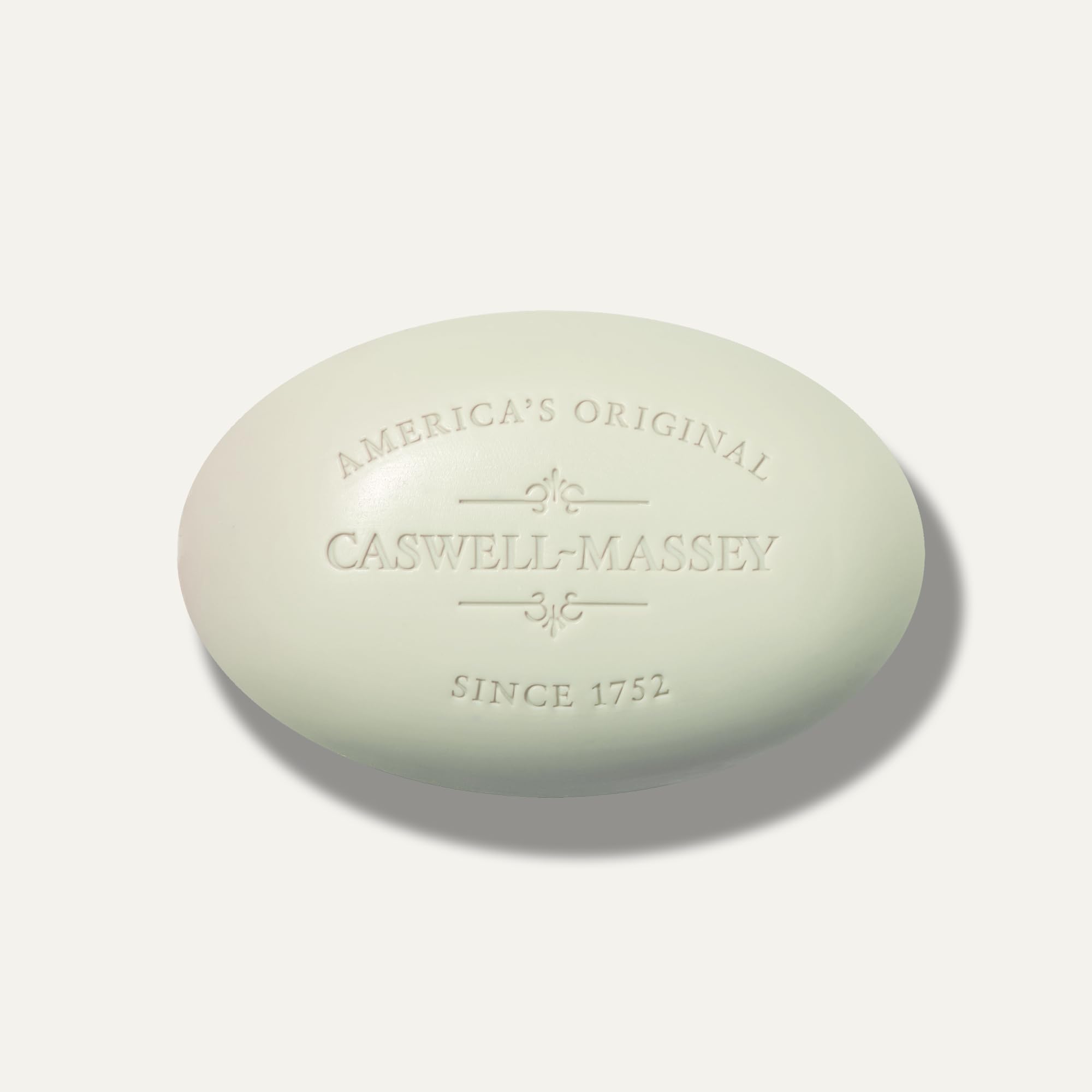 Caswell-Massey soaps staged in a bathroom conveying premium lifestyle and scent benefit