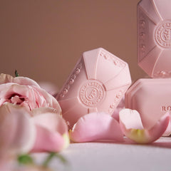 Caswell-Massey lather in hand illustrating rich, moisturizing foam benefit