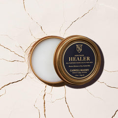 Close-up of salve texture showing smooth beeswax surface and nourishing consistency
