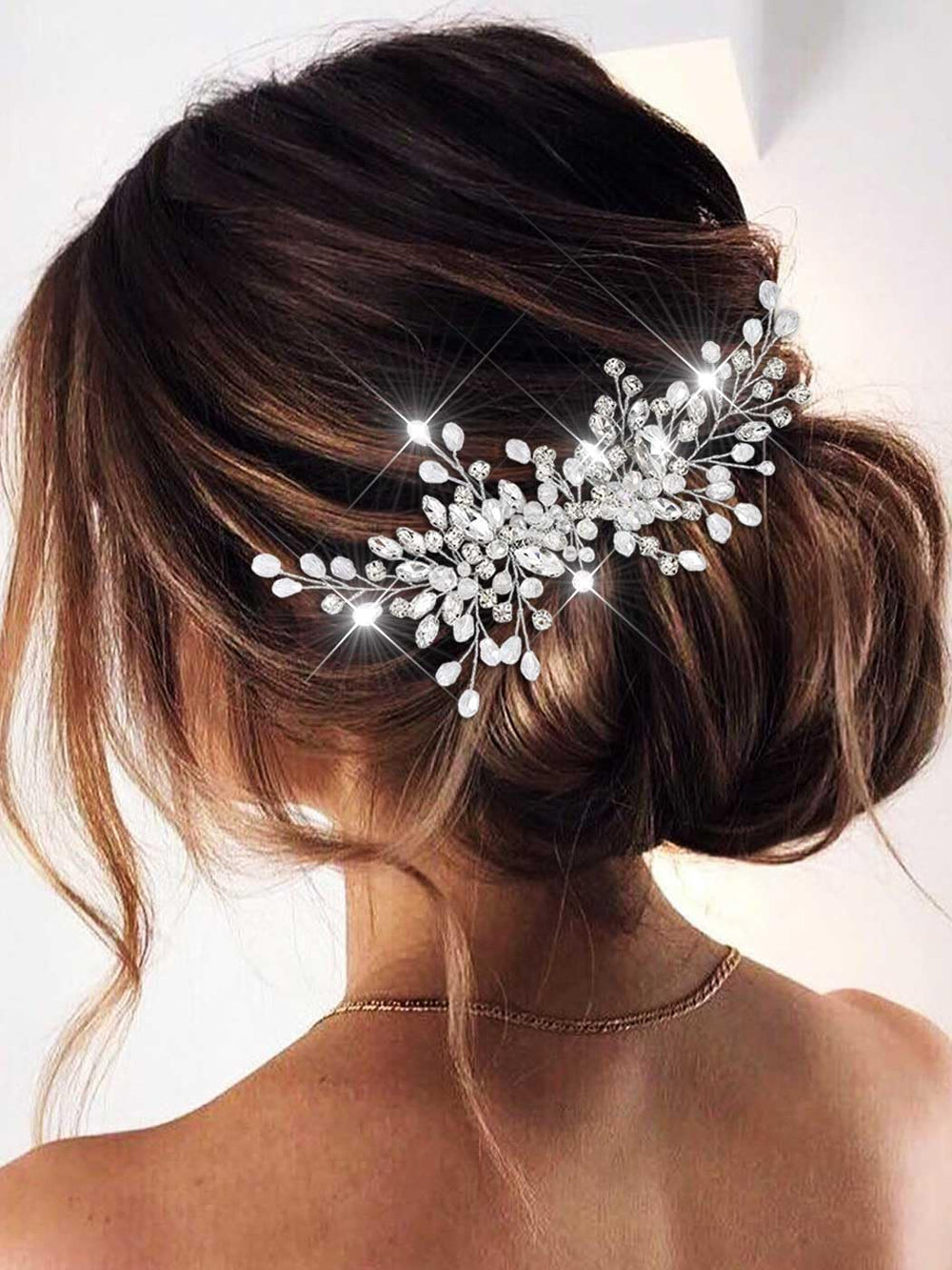 Catery silver comb front view showing sparkly rhinestones and elegant silhouette benefit: bridal polish