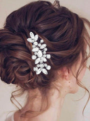 Catery comb inserted in bridal updo showing secure hold and polished finish benefit