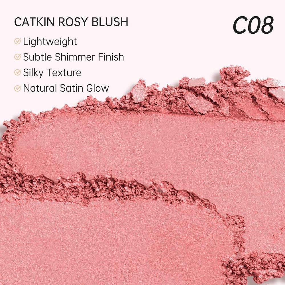 Model applying Catkin blush on cheeks showing fresh glow and wearable shimmer