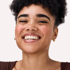 Catrice blush applied to model cheeks giving natural lifted glow and warmth