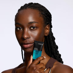 Catrice Cosmetics bottle next to a coin showing compact travel-friendly size