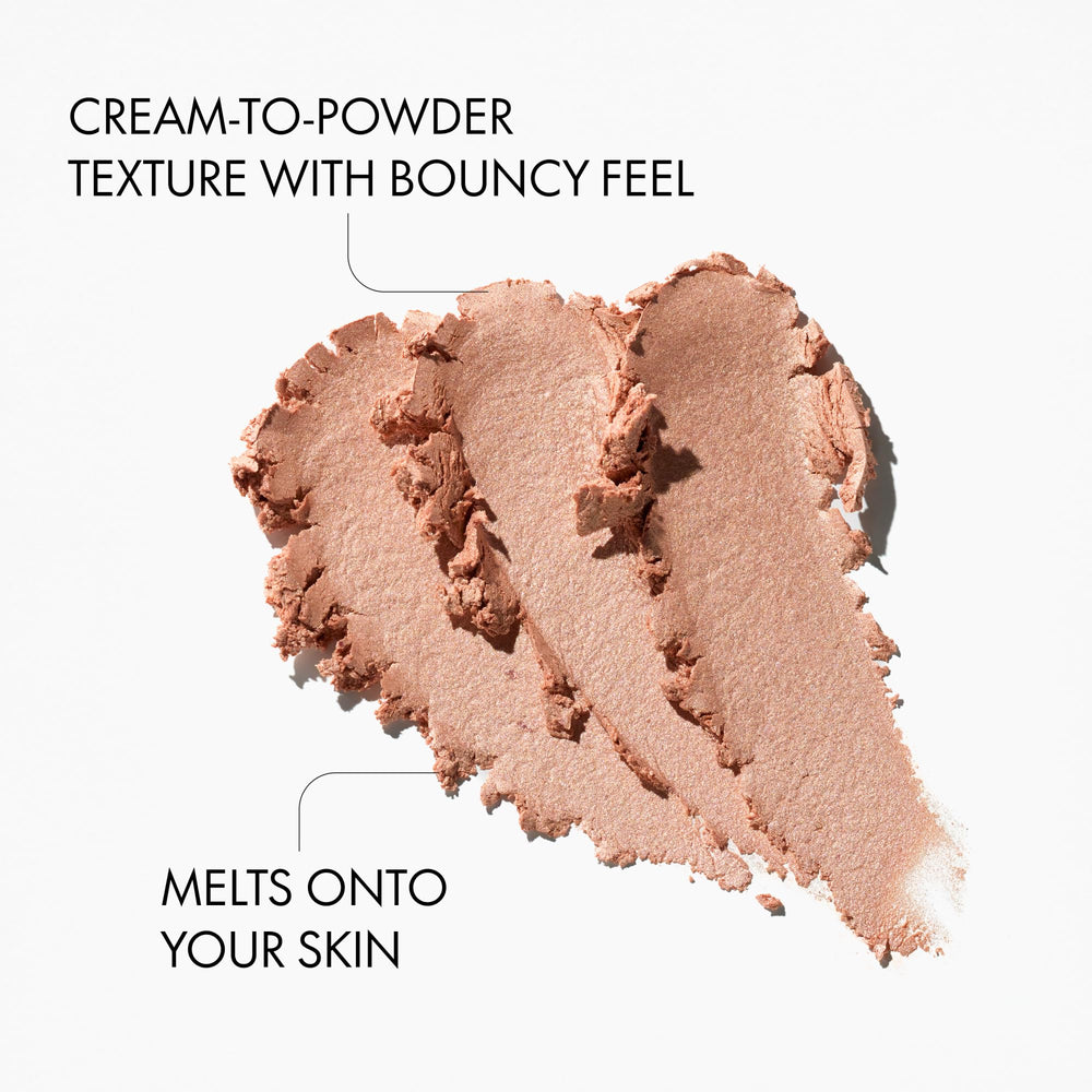 Catrice swatch on arm demonstrating Moonlit Sand shimmer and buildable glow