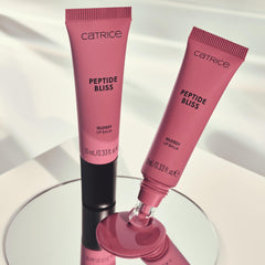 Catrice Peptide Bliss worn on lips at night out showing polished luminous look