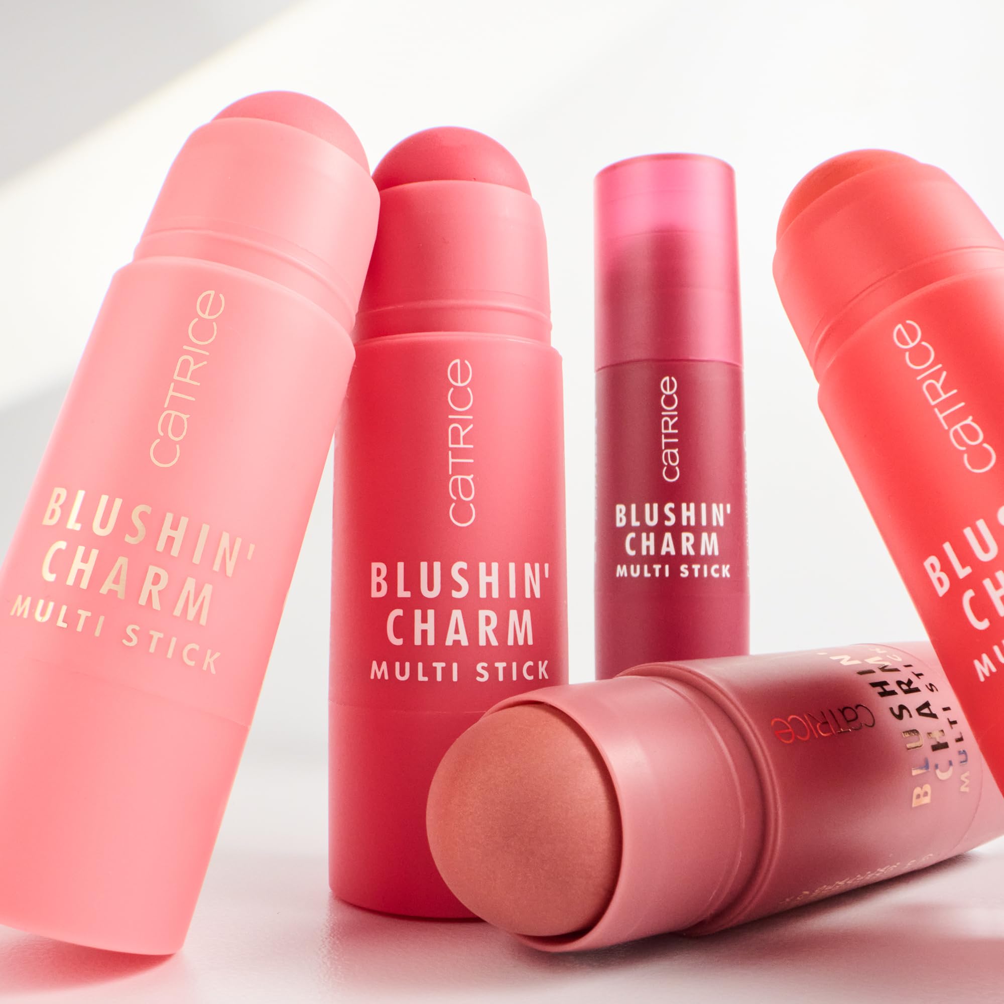 Catrice flatlay with multi stick and brush showing coordinated cheek-and-lip routine
