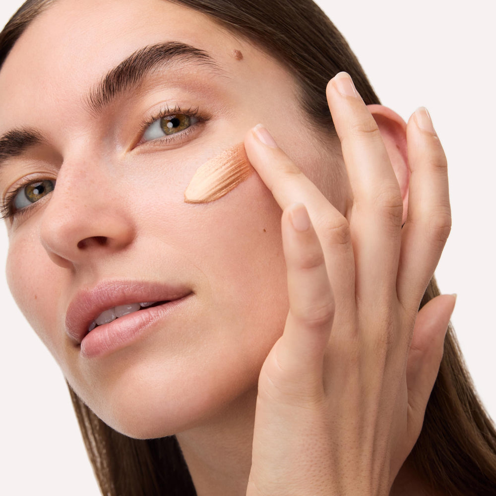 Catrice bottle beside hyaluronic and coconut visuals showing hydrating ingredient focus