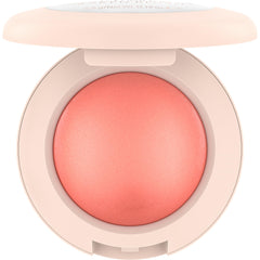 Catrice swatch of Cheeky Coral on skin illustrating buildable, luminous color