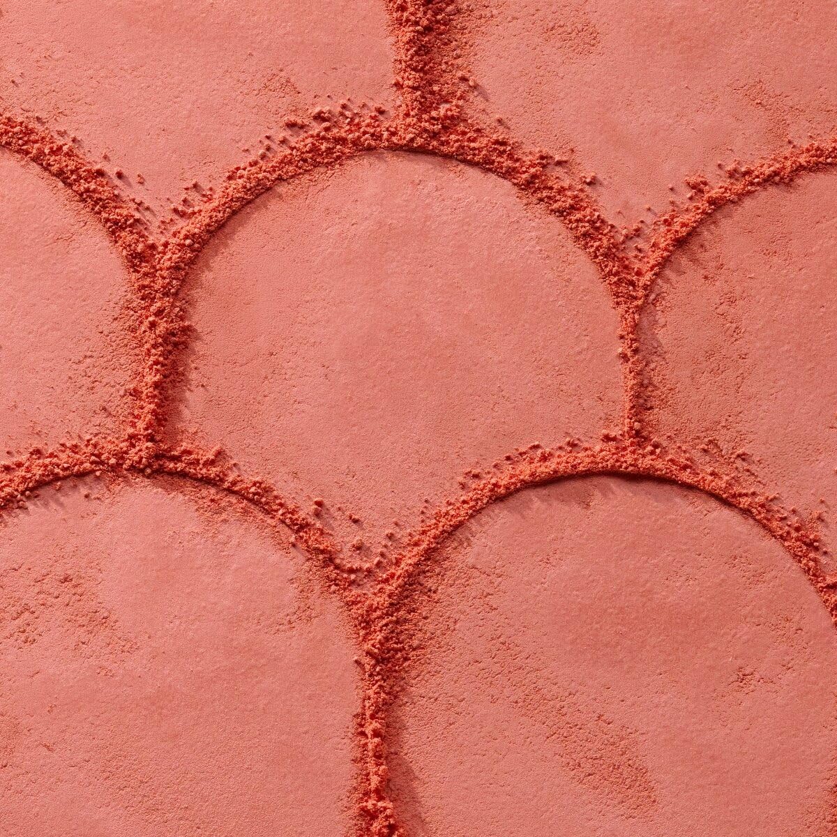 Catrice blush being picked up by brush demonstrating easy pick-up and blend
