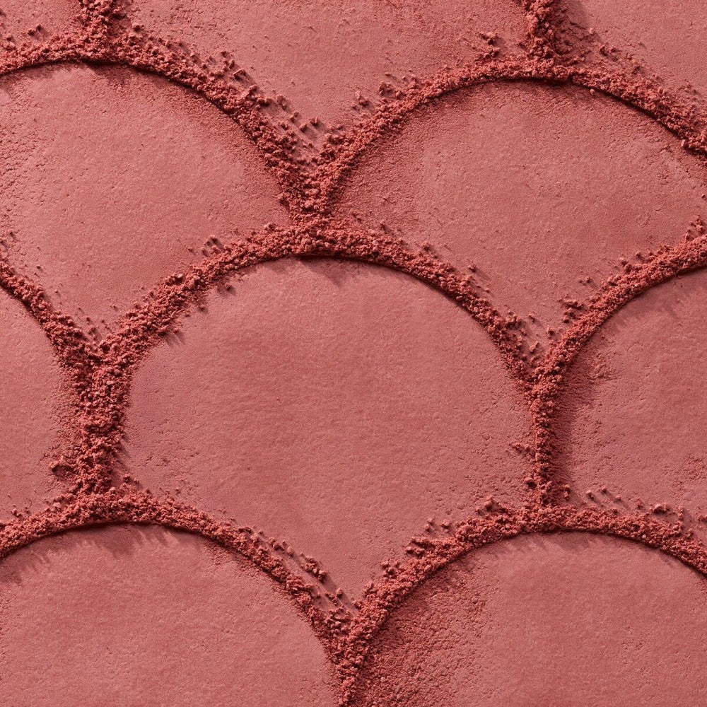 Catrice swatch on arm illustrating buildable berry color payoff benefit