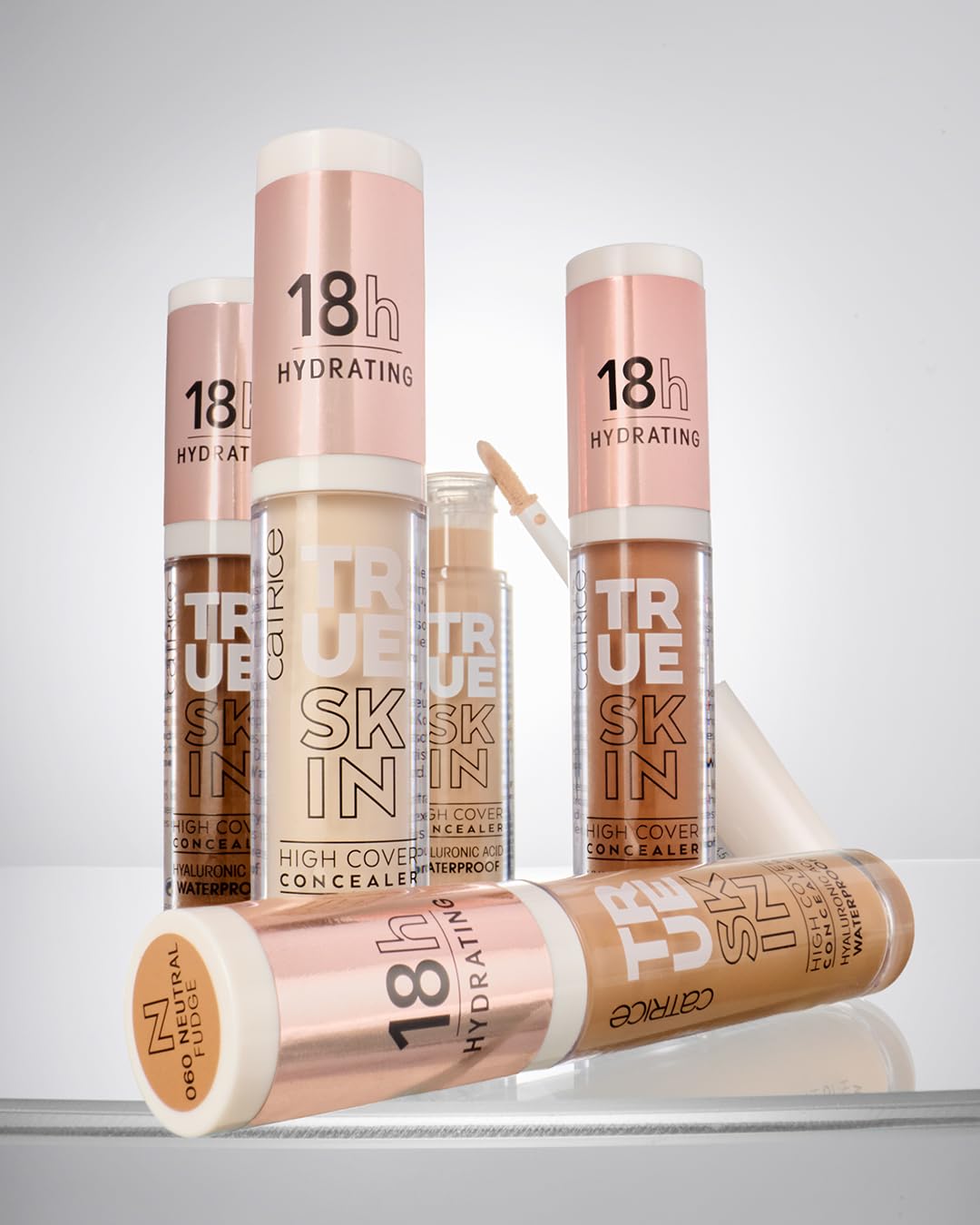 Size comparison of Catrice True Skin next to a tube for scale and travel-ready benefit