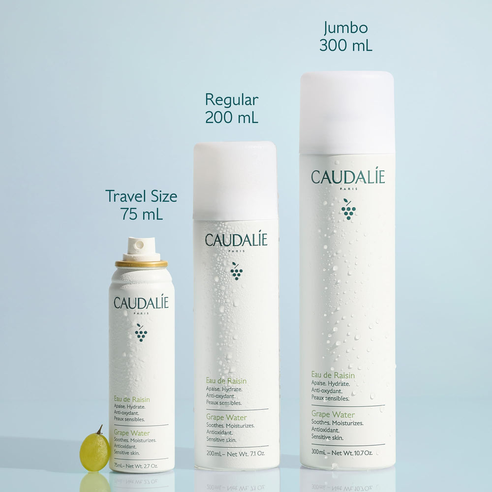 Caudalie grape water held in hand showing 75 mL travel-friendly size