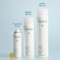 Caudalie grape water held in hand showing 75 mL travel-friendly size