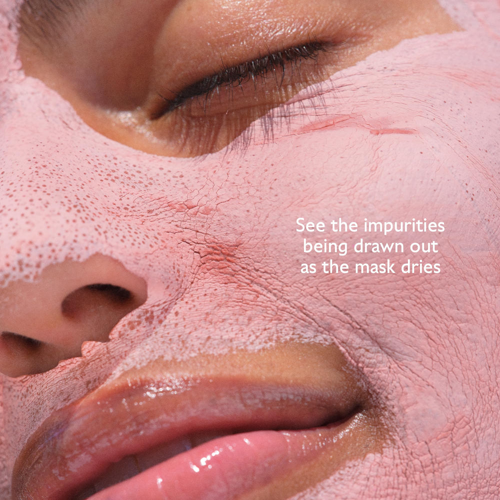 Pink clay and grapes arranged with Caudalie tag highlighting natural ingredients