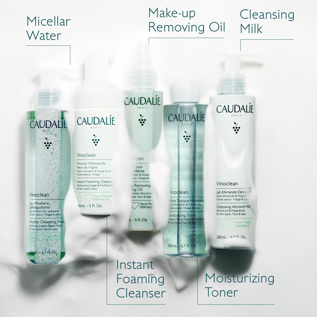 Caudalie bottle with almonds and grape seeds highlighting nourishing ingredients