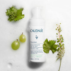 Caudalie pump dispensing foam illustrating easy foaming action and gentle cleanse
