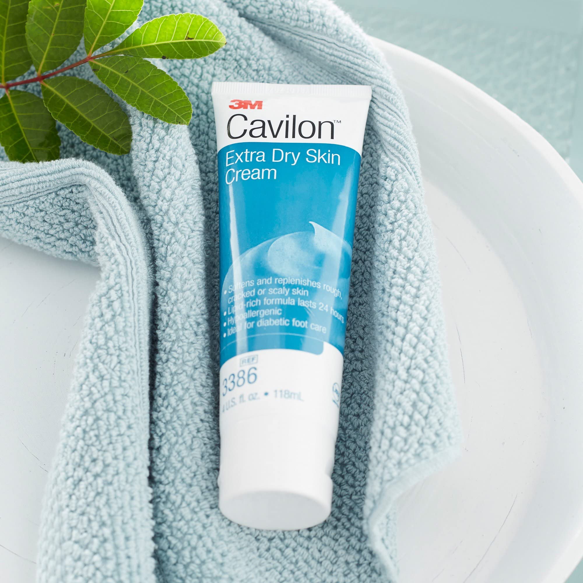 Cavilon 3M 4 oz tube next to common objects to show portable size