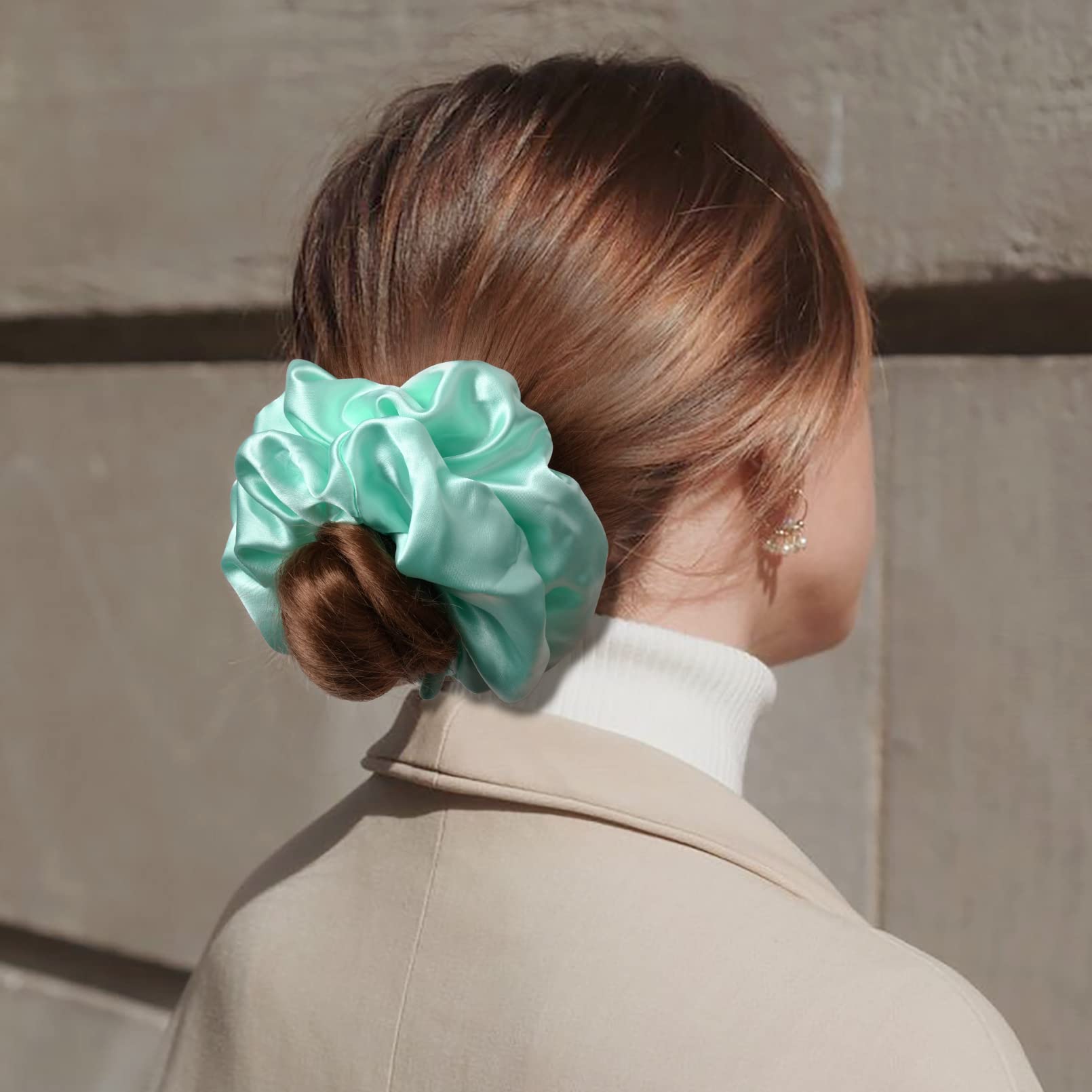 CEELGON scrunchie shown in hand to illustrate large 6.5-inch scale and coverage