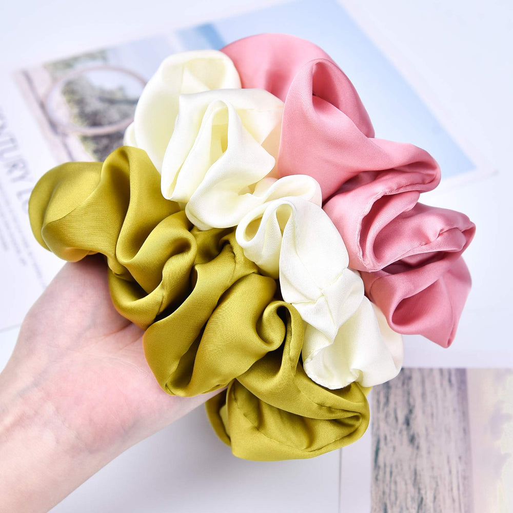 CEELGON scrunchie next to hand to show 6.25 inch scale, clear size guide