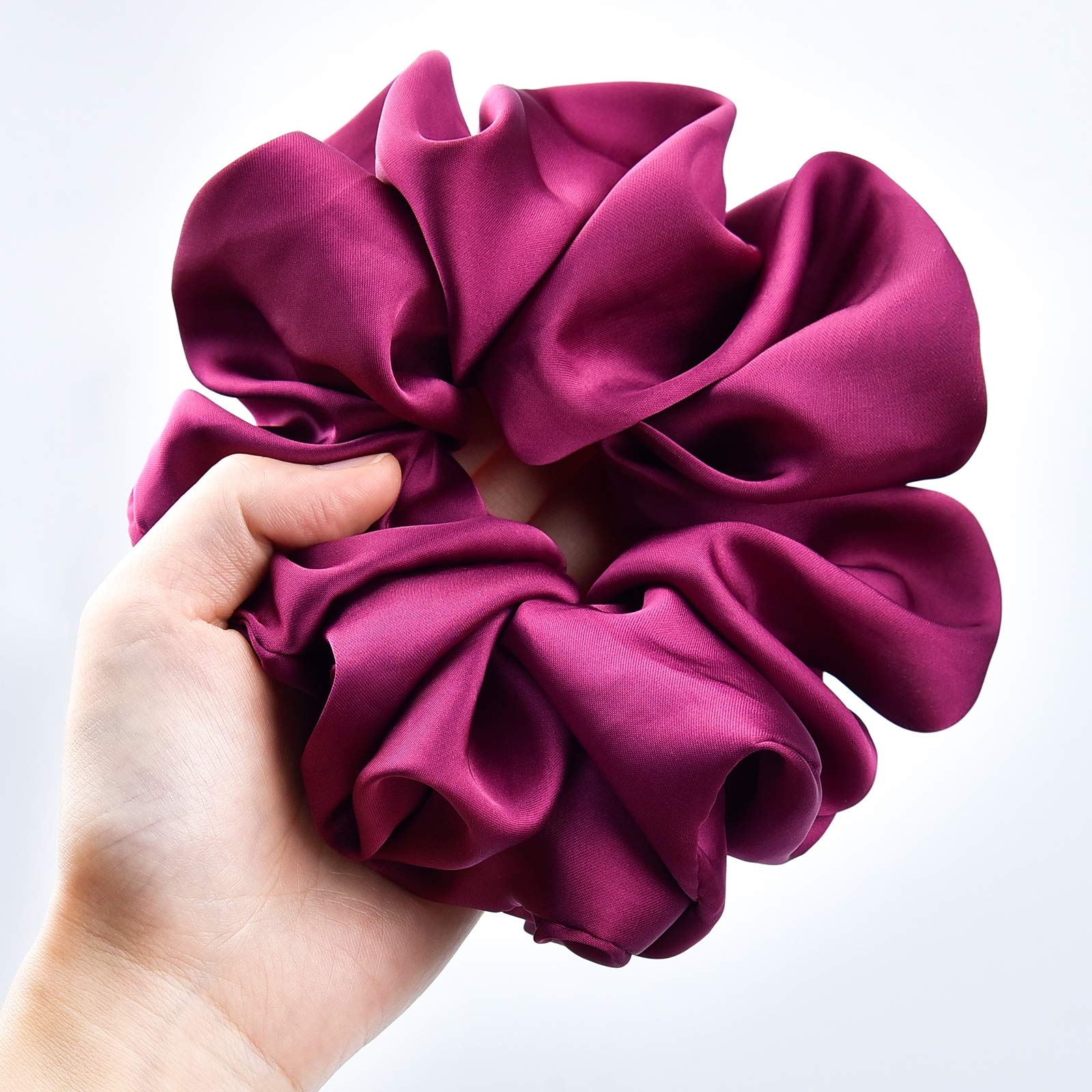 CEELGON scrunchie held in hand to show generous 6.25-inch scale