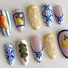CEWEWP close-up of 3D goldfish and lemon details highlighting playful summer nail art