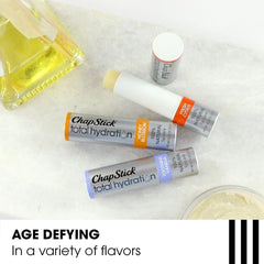 Argan oil and avocado butter near ChapStick highlighting natural nourishment