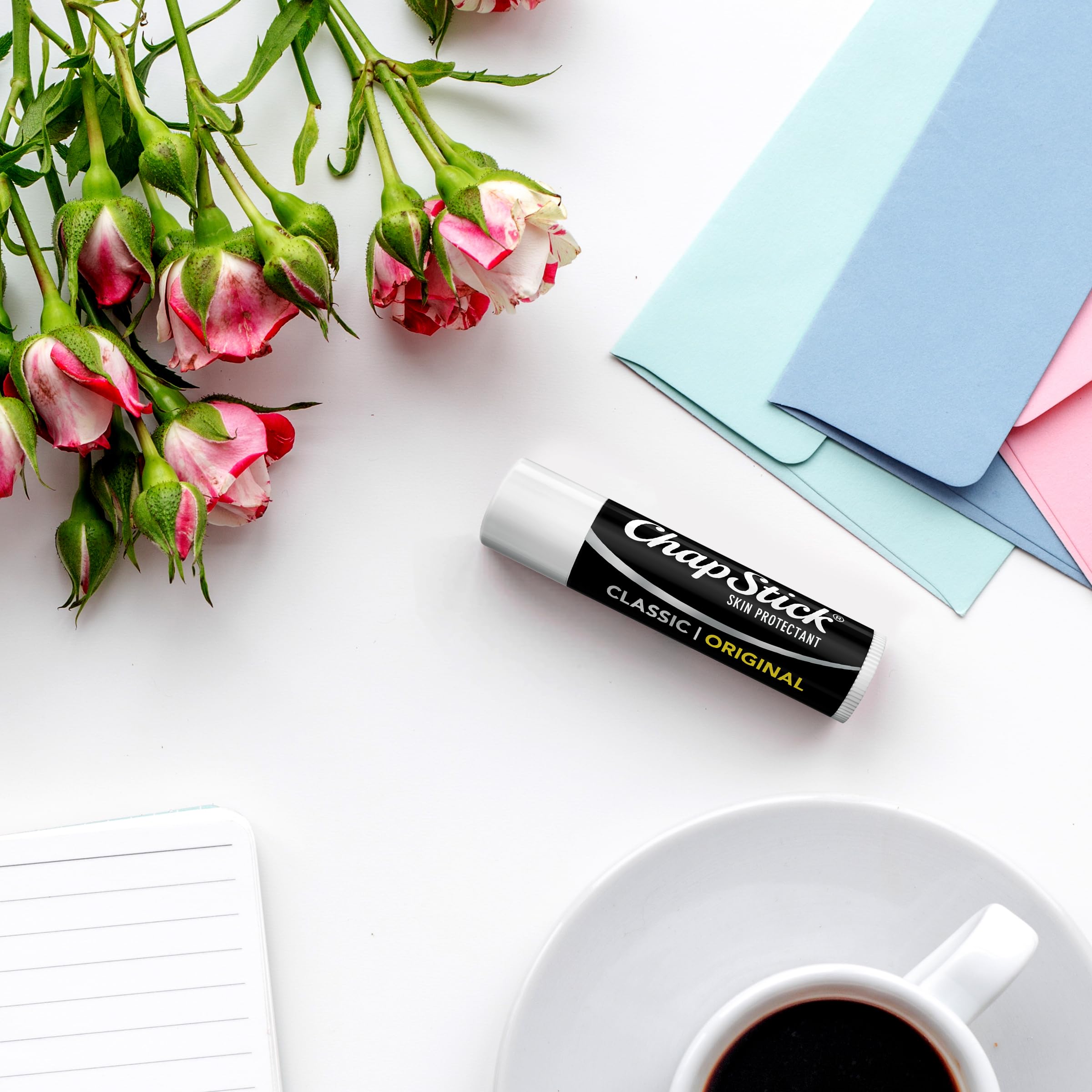 Applying ChapStick classic in hand to show quick lip moisture boost