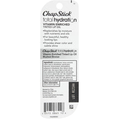 ChapStick placed inside a purse pocket showing on-the-go portability and quick touch-ups