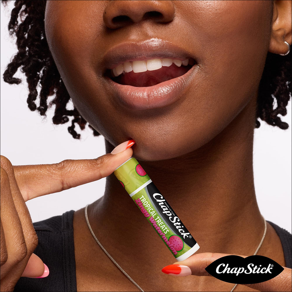 Hand holding ChapStick pack demonstrating portability and on-the-go convenience